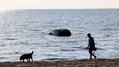 Stolen car recovered from lake on South Side, another vehicle stuck in sand, police say 