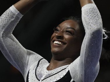 Simone Biles dazzles in her return to competitive gymnastics to easily win the U.S. Classic in Hoffman Estates